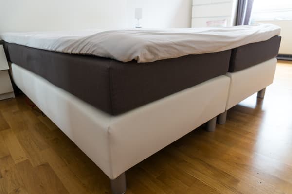 A close-up of an exposed box spring